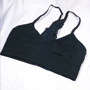 V-neck, black Auden bra with lace in the back.